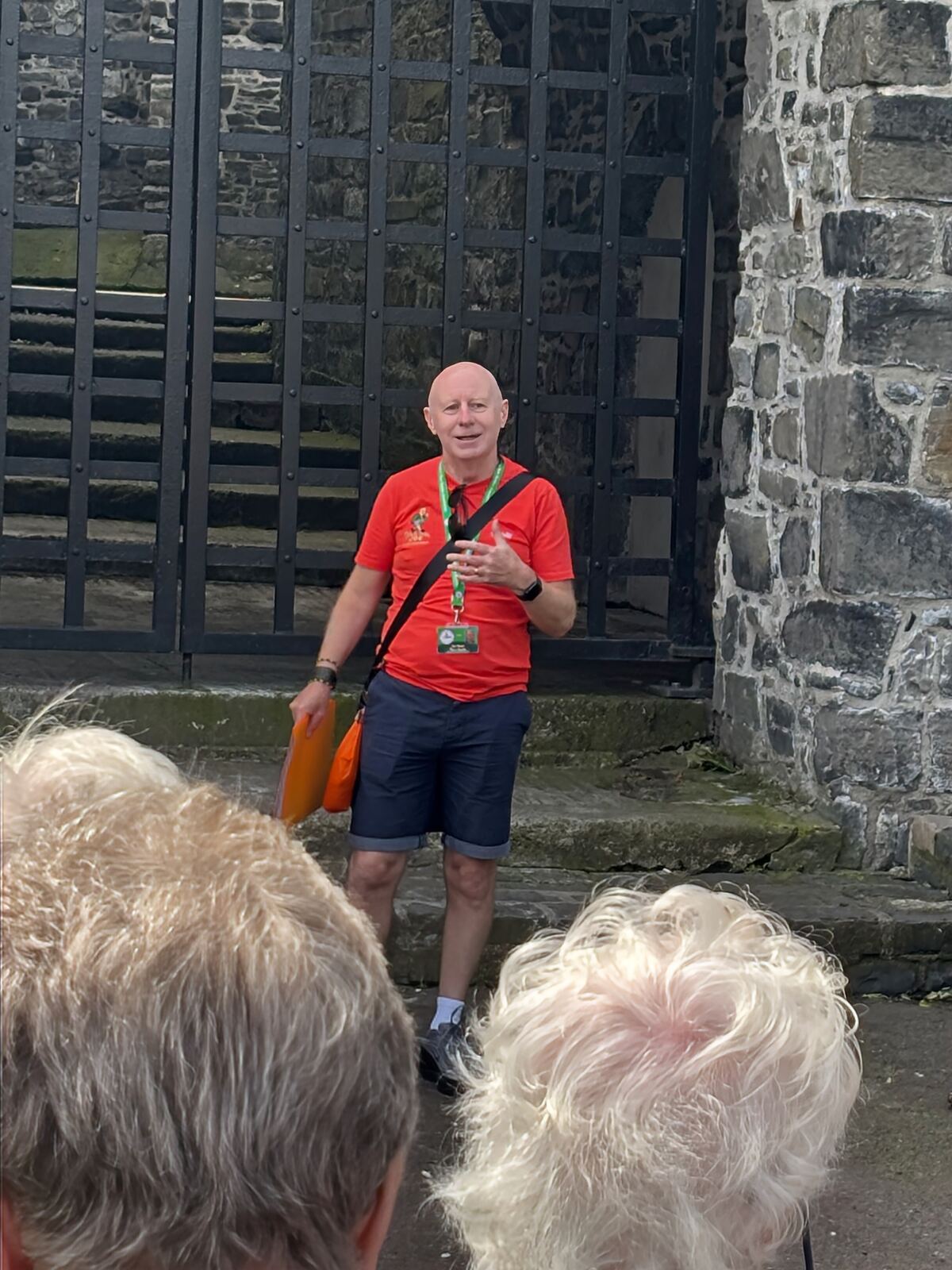 Joe telling a story at a medieval gateway