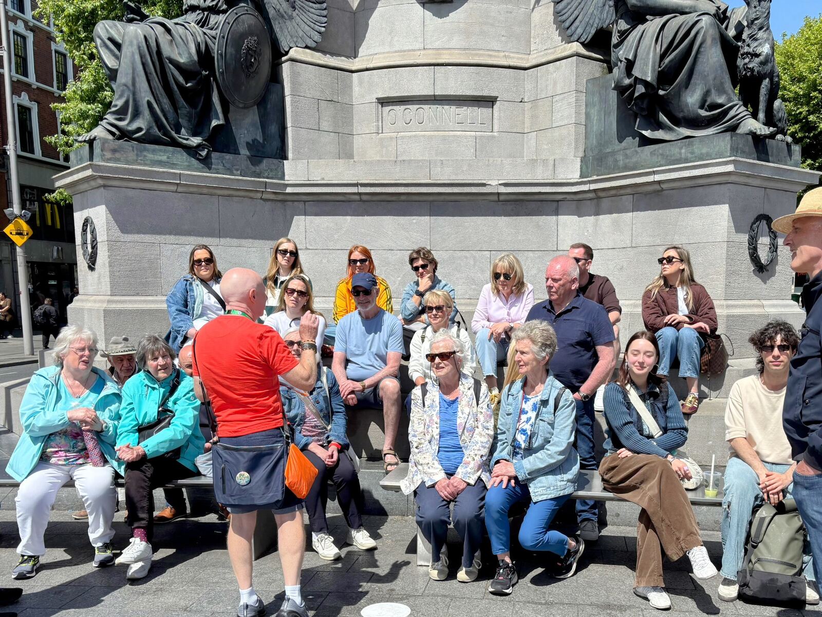 A group seated at the O'Connell Monument