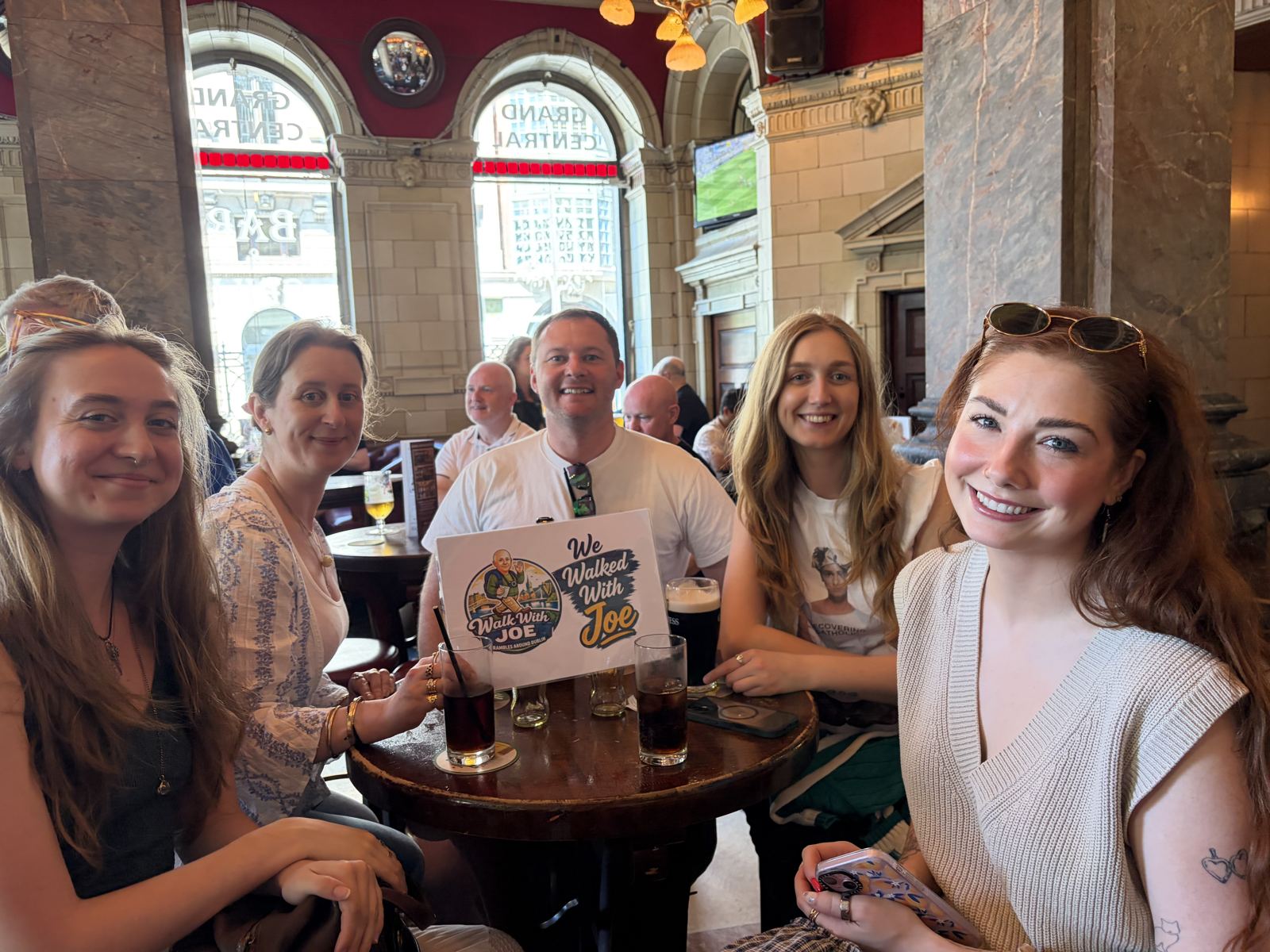 A group in a Dublin pub with the sign