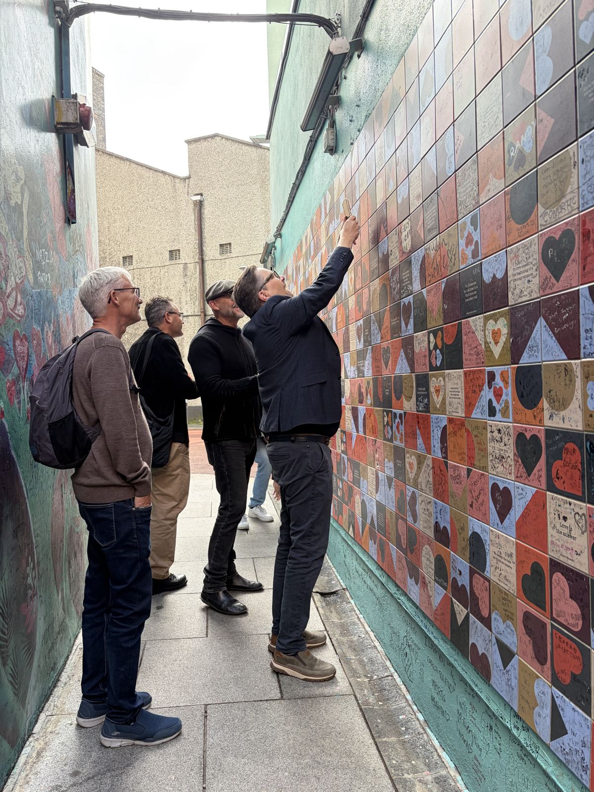 Joe showing guests the heart wall